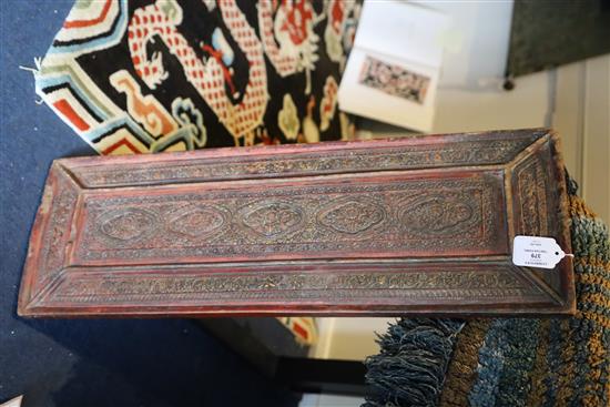 A Tibetan carved panel, 18th/19th century, 72.5cm x 24cm